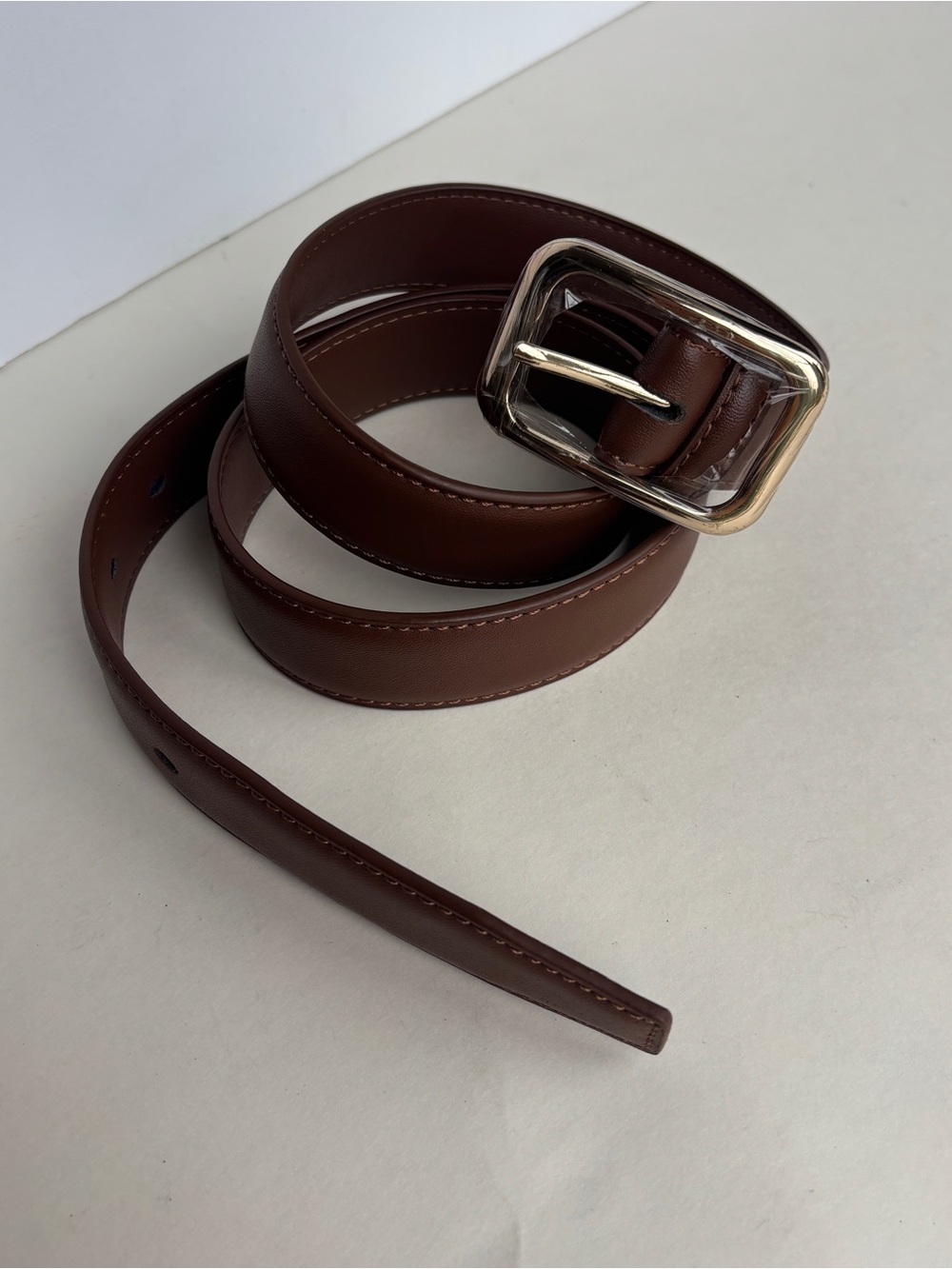 Brown leather belt with gold buckle